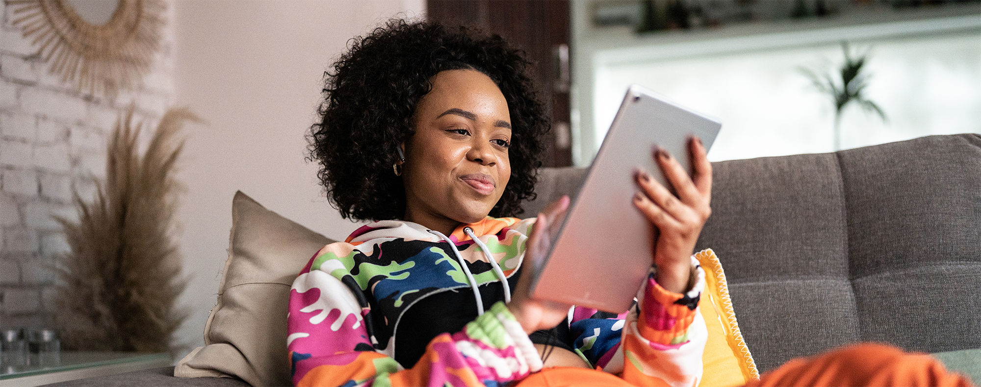 Young woman using a digital tablet at home Young woman using a digital tablet at home